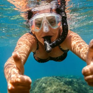 a man swimming in a body of water