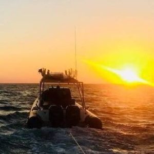 a sunset over a body of water