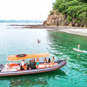 a group of people on a boat in the water