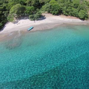 a man riding a wave on top of a body of water