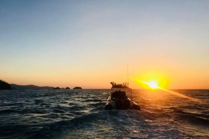 a sunset over a body of water