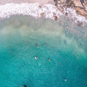 a person riding a wave on a surfboard in the water