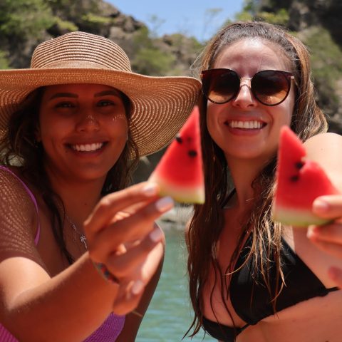 a woman wearing sunglasses and smiling